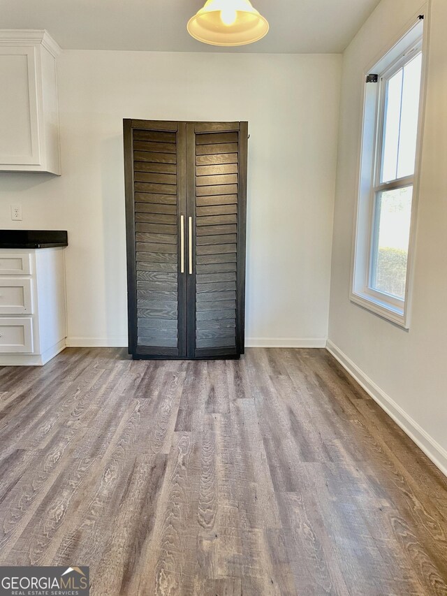 unfurnished bedroom featuring light wood-type flooring