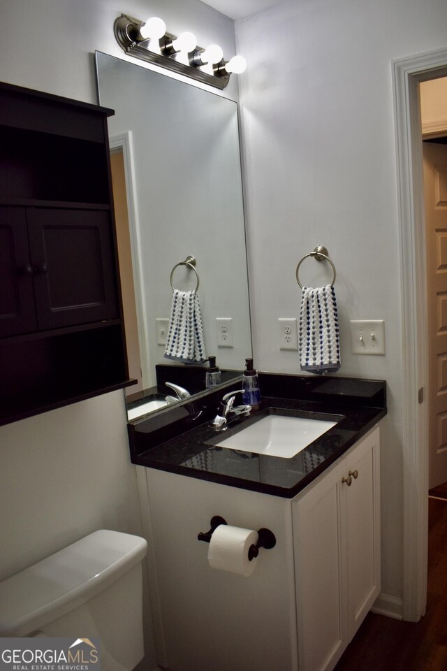 bathroom with vanity and toilet