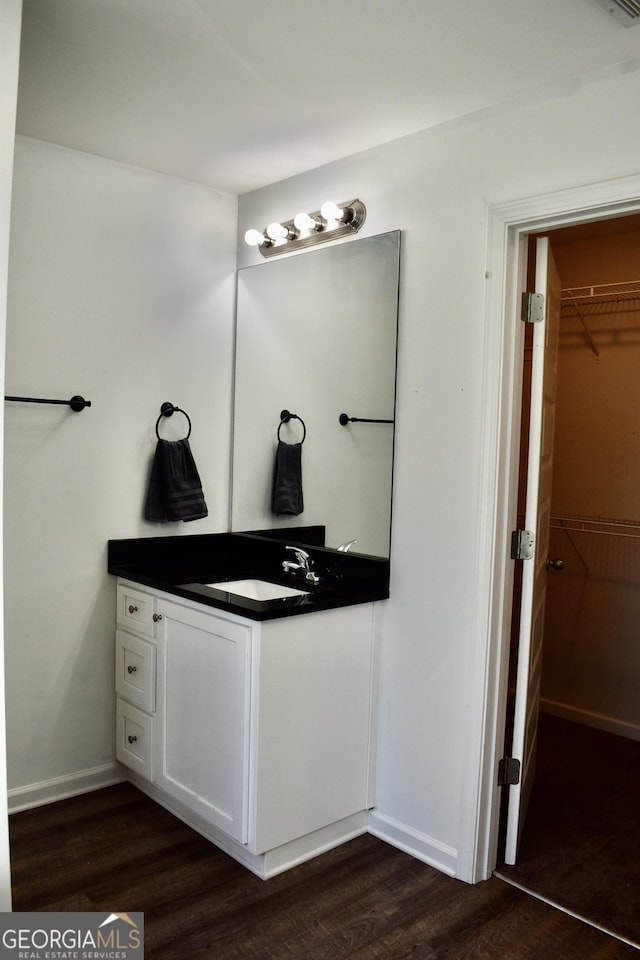 bathroom featuring vanity and hardwood / wood-style floors