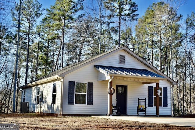 view of front of home with central AC and a porch