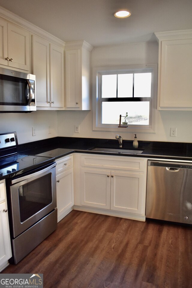 kitchen with white cabinetry, sink, and appliances with stainless steel finishes