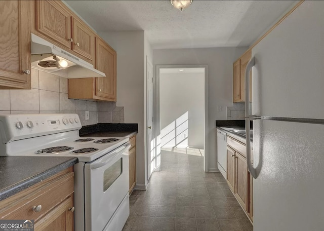 kitchen with white appliances, decorative backsplash, and a textured ceiling