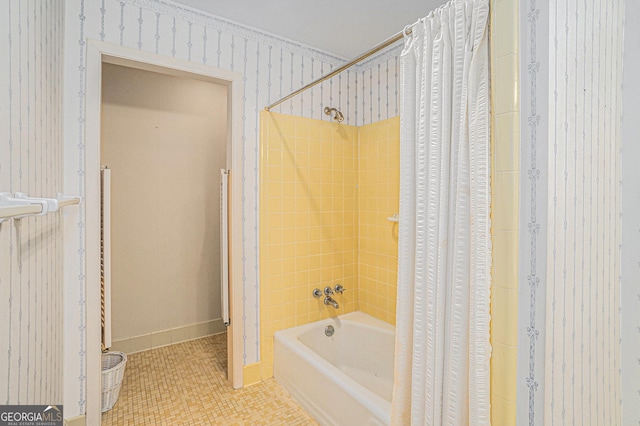 bathroom with shower / bath combination with curtain and tile patterned floors