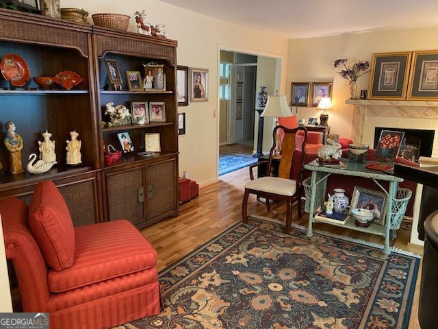 sitting room with hardwood / wood-style floors