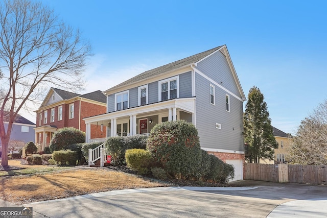 view of front of home with a garage and a porch