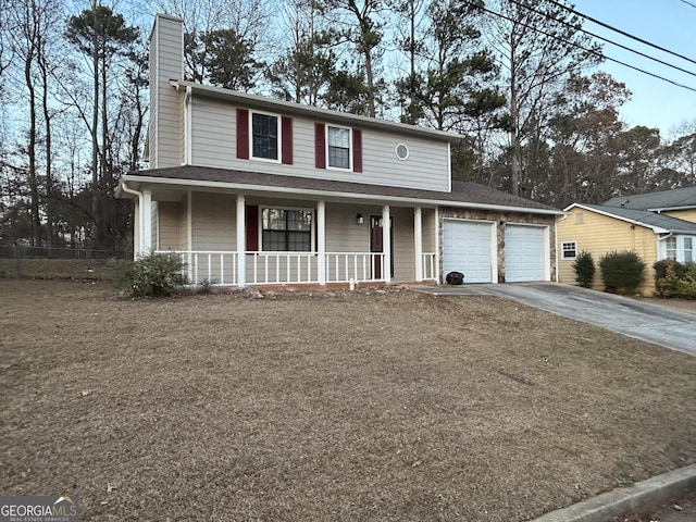 view of front of home with a garage and a porch