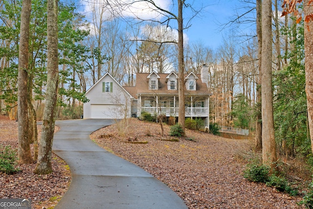 cape cod-style house featuring a porch