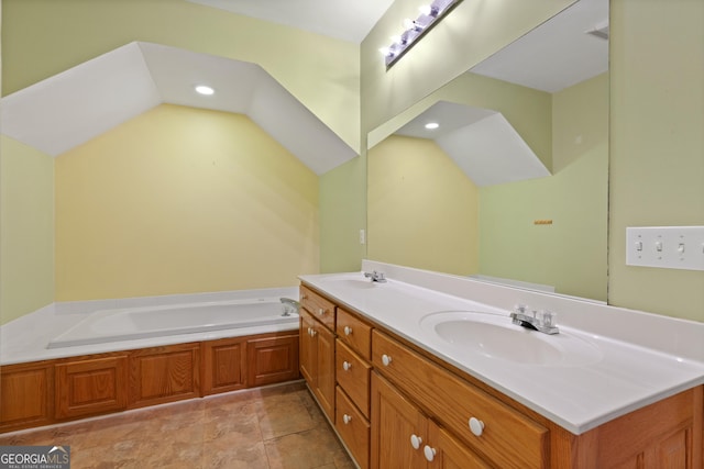 bathroom with vanity and a tub