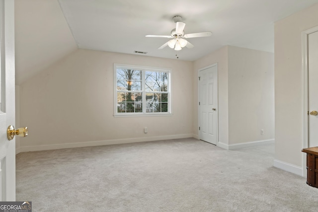 bonus room featuring lofted ceiling, light colored carpet, and ceiling fan