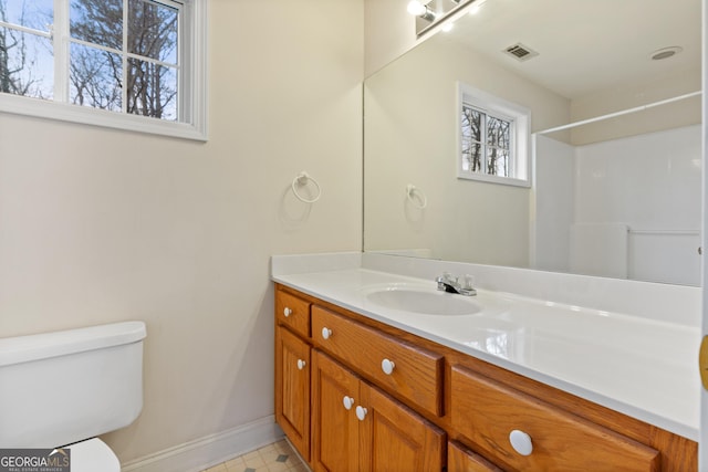 bathroom with vanity and toilet