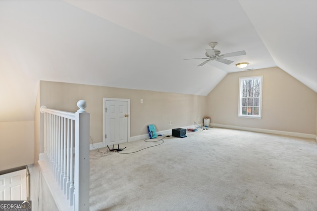 bonus room featuring vaulted ceiling, light carpet, and ceiling fan