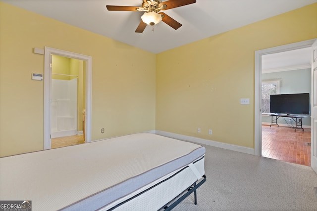 bedroom featuring connected bathroom and ceiling fan