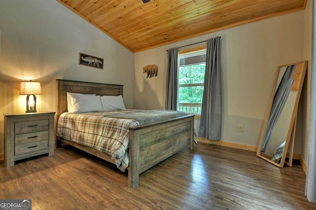 bedroom featuring lofted ceiling, dark wood-type flooring, and wood ceiling