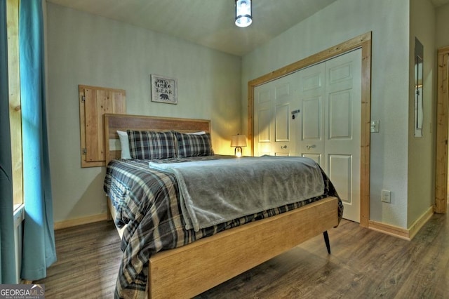 bedroom featuring dark hardwood / wood-style flooring