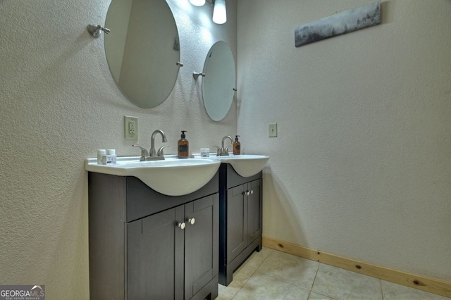 bathroom with tile patterned flooring and vanity