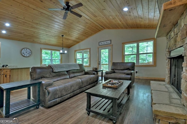 living room with wood-type flooring, lofted ceiling, wood ceiling, and a fireplace