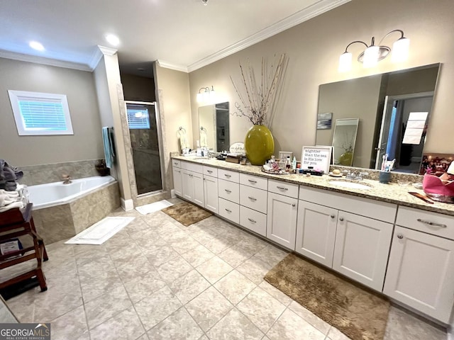 bathroom featuring tile patterned floors, ornamental molding, separate shower and tub, and vanity