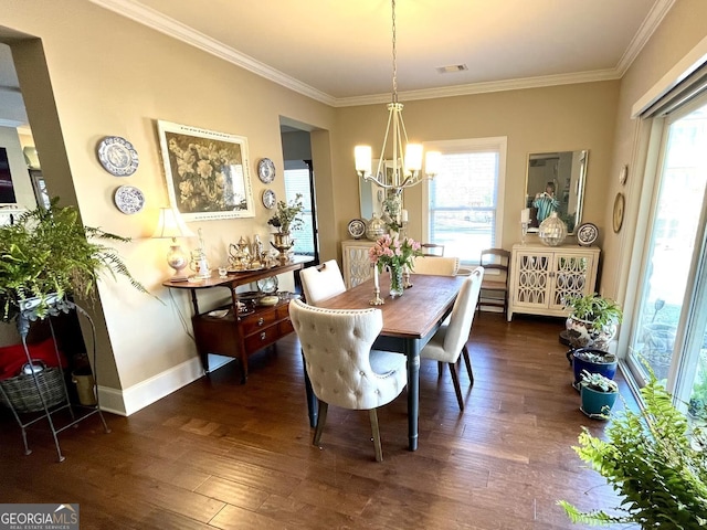 dining space with crown molding, dark hardwood / wood-style floors, and a chandelier