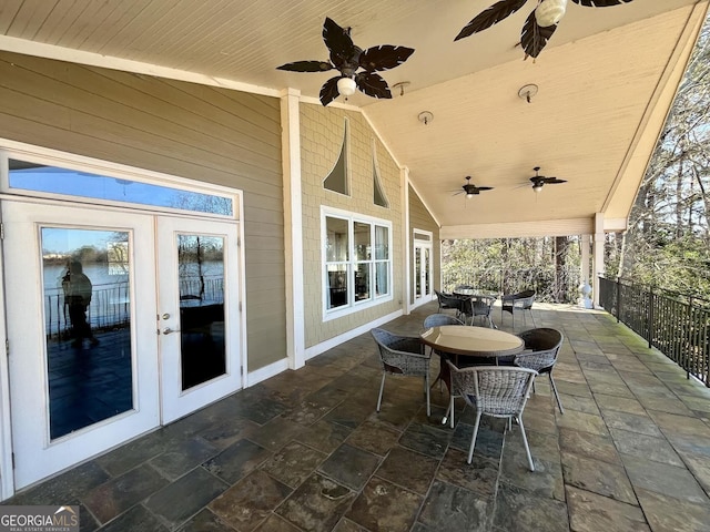 view of patio with french doors and ceiling fan