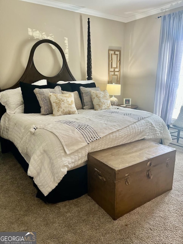 carpeted bedroom with ornamental molding