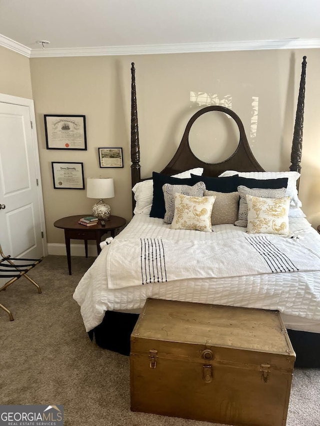 carpeted bedroom featuring crown molding