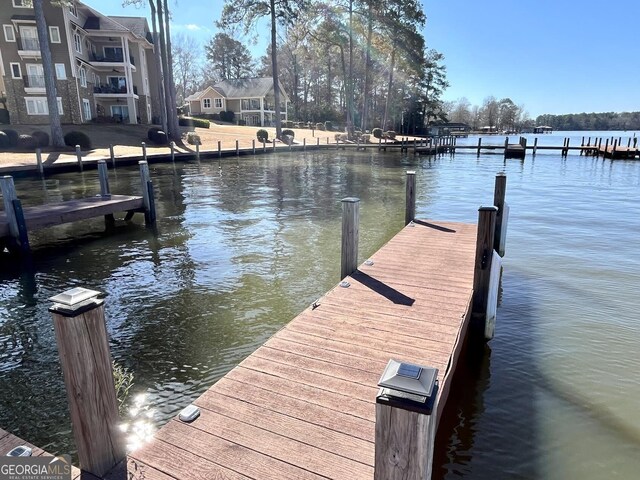 view of dock with a water view