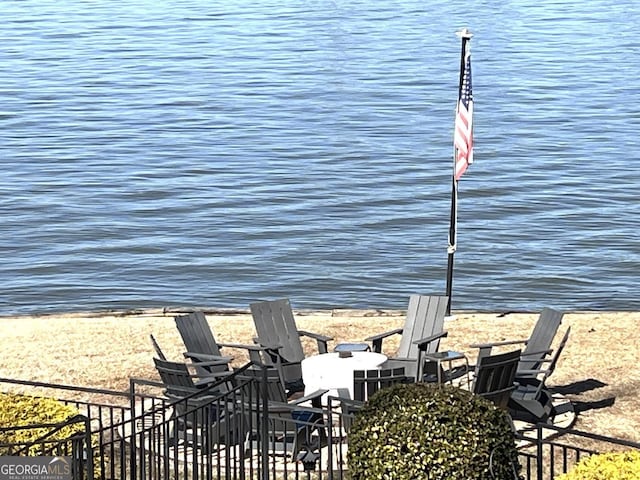 view of patio with a water view