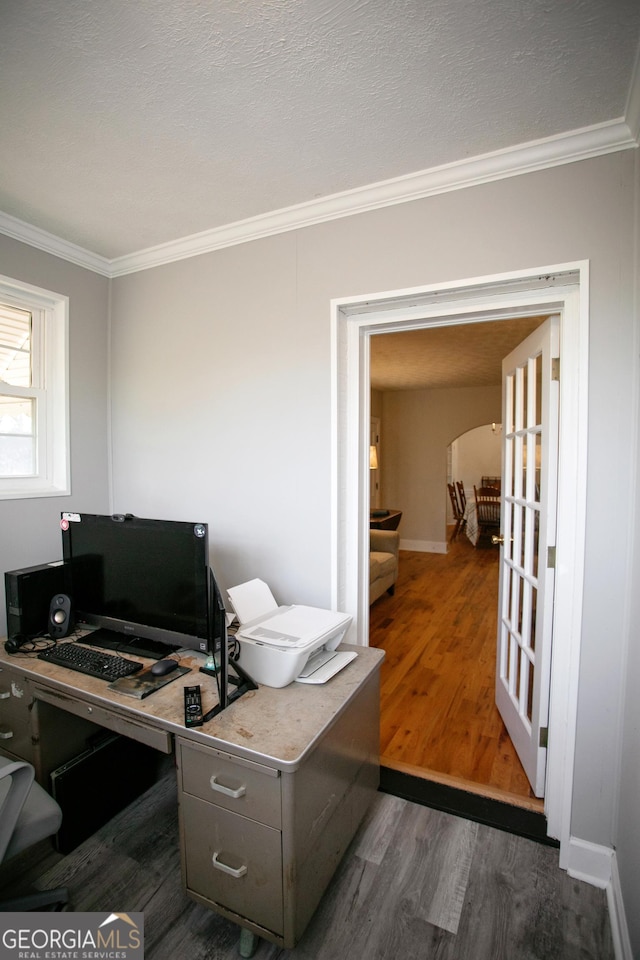 office featuring crown molding, a textured ceiling, and dark hardwood / wood-style flooring