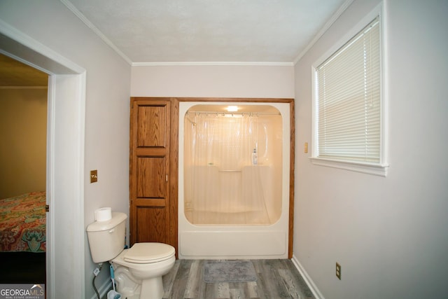 bathroom featuring shower / tub combo, hardwood / wood-style floors, ornamental molding, and toilet