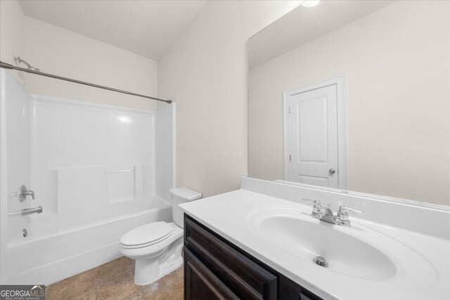 full bathroom featuring shower / washtub combination, vanity, and toilet