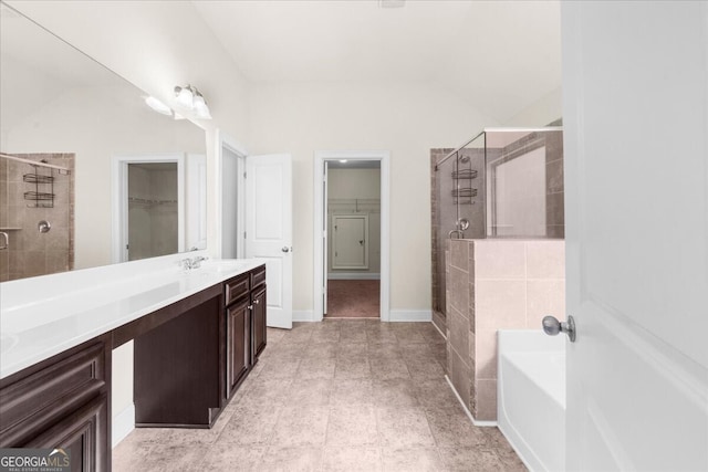 bathroom featuring vanity and shower with separate bathtub