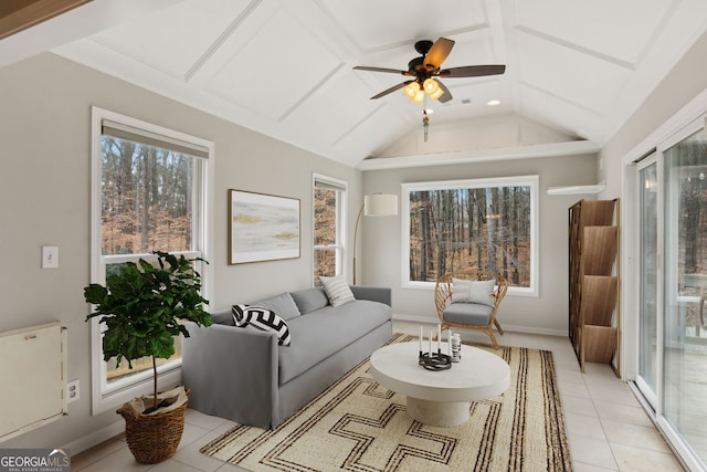 tiled living room featuring vaulted ceiling and ceiling fan