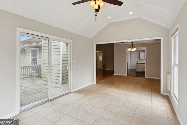 tiled empty room featuring vaulted ceiling, radiator, and ceiling fan