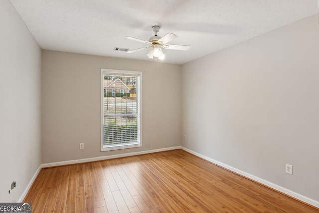 unfurnished room featuring ceiling fan and light hardwood / wood-style floors