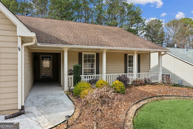 doorway to property featuring a porch