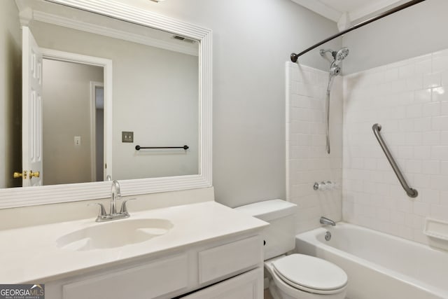 full bathroom with vanity, tiled shower / bath, and toilet