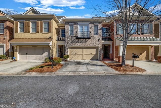 view of property featuring concrete driveway, brick siding, and an attached garage