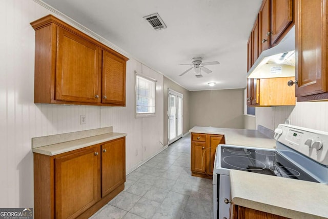 kitchen featuring ceiling fan and electric range