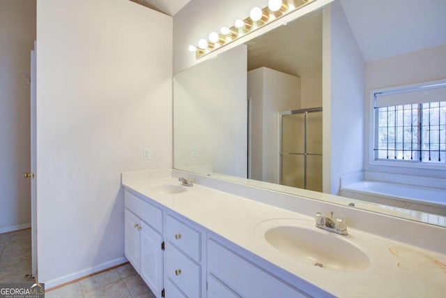 bathroom with vaulted ceiling, vanity, separate shower and tub, and tile patterned flooring