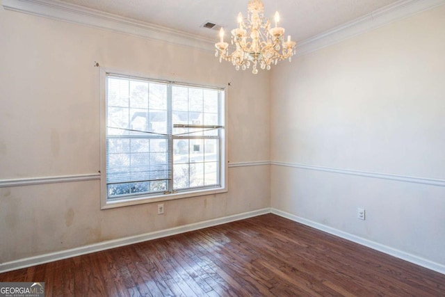 unfurnished room with a notable chandelier, crown molding, and dark wood-type flooring