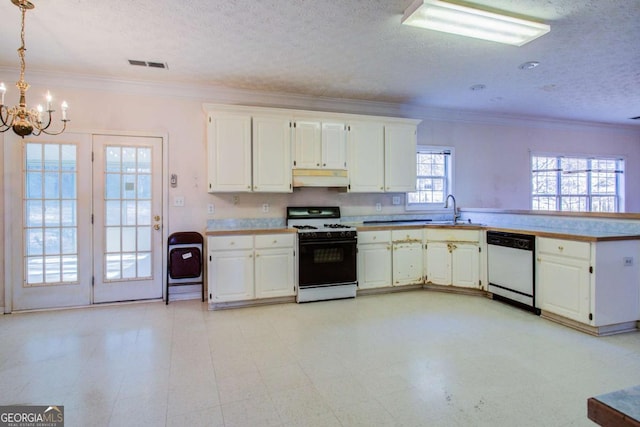 kitchen featuring sink, white appliances, white cabinetry, hanging light fixtures, and ornamental molding