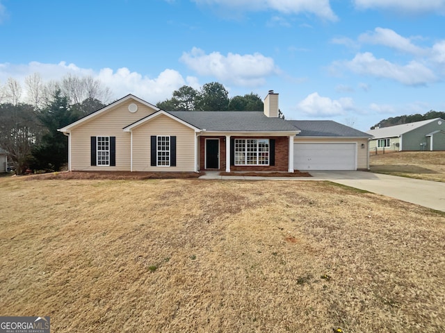 ranch-style house with a garage and a front yard