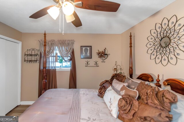 living room with ceiling fan, hardwood / wood-style floors, and a textured ceiling