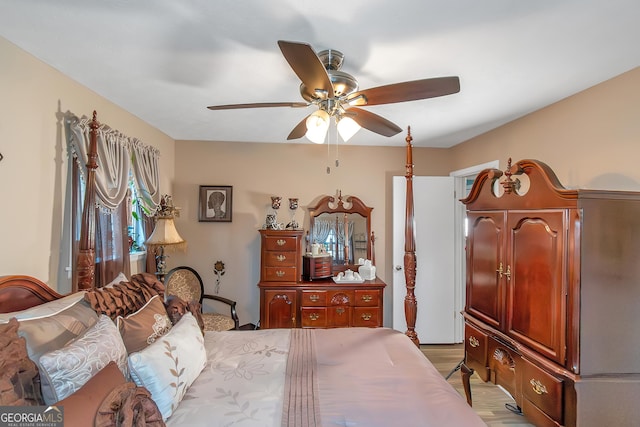 bedroom with light hardwood / wood-style floors and ceiling fan