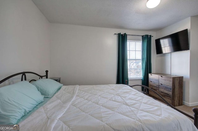 bedroom featuring a textured ceiling