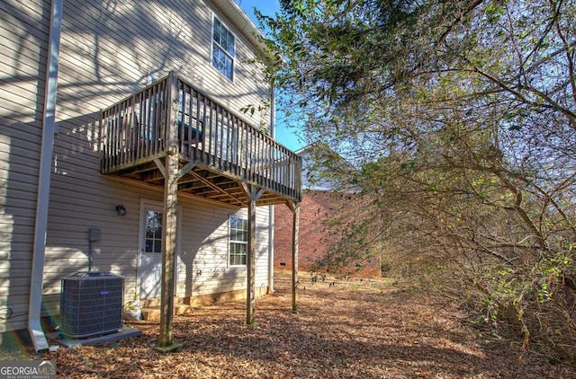 rear view of house with central air condition unit