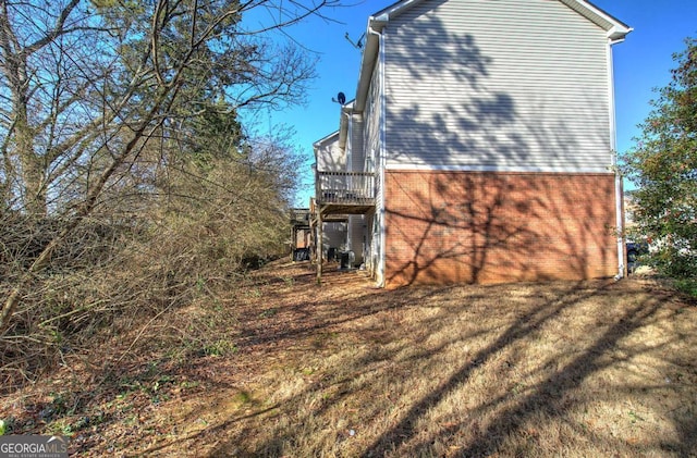 view of side of property with a yard