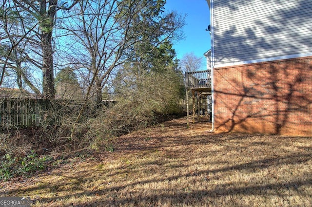 view of yard featuring a wooden deck