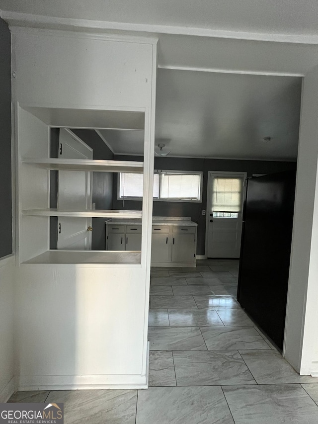 kitchen featuring black refrigerator