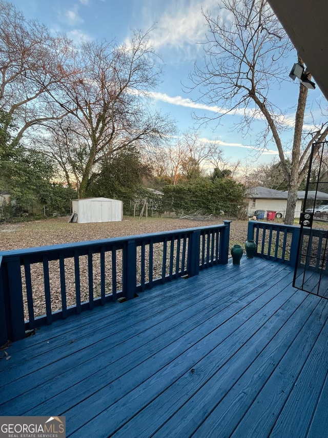 wooden terrace with a shed